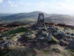 Gowbarrow Fell with Little Mell Fell mid horizon behind the Trig point.