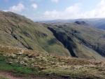 High Bakestones summit cairn on top left skyline. Little Hart Crag on the right.