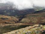 A gap in the clouds with Steel Edge below me to the right. It looks deceptively gentle from here.