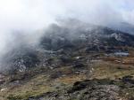 Looking back down the track to Three Tarns and lowering clouds.
