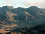 Scafell Pike, Broad Crag and Ill Crag. Pyrimidal cone of Pen perched ontop of Esk Buttress below.