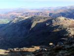 A sliver of sunlight on Dovenest Crag in centre of shadow.