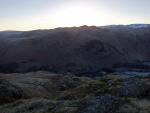 The sun is just getting up behind Angletarn Pikes.