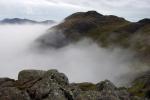 Top of Harrison Stickle poking above the mist