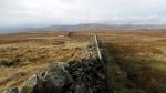 Dropping down from the fog on Knoutberry Haw to see the Howgills in the west.